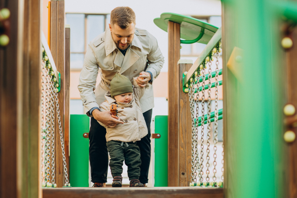 father-with-baby-son-play-ground-having-fun