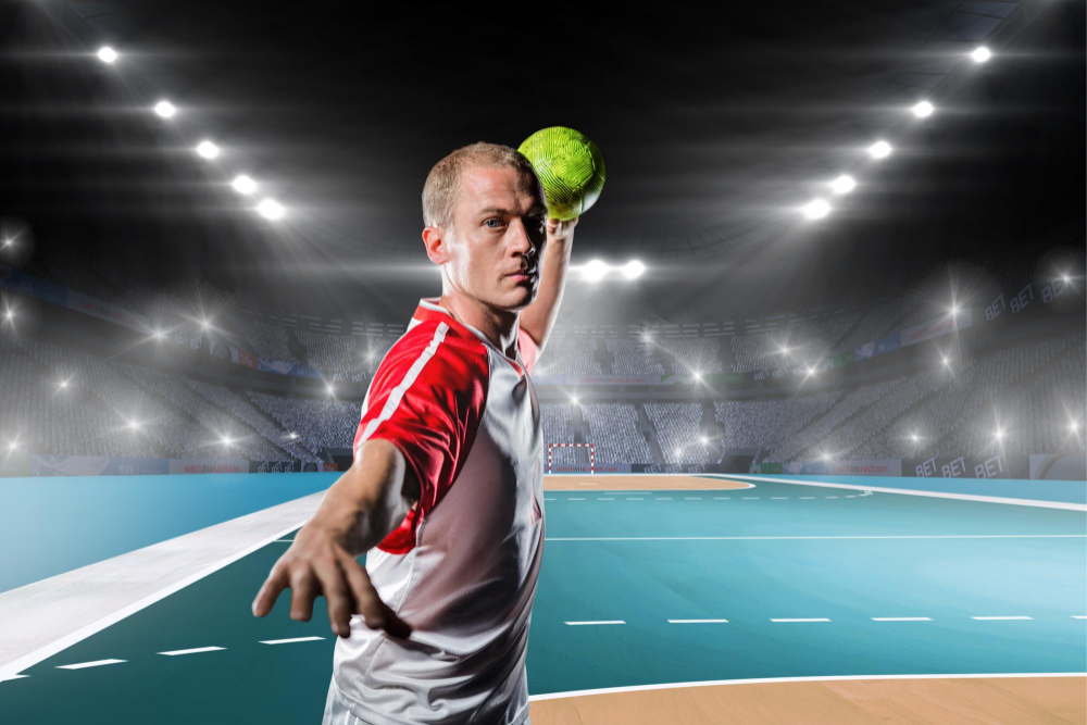 sportsman-throwing-ball-against-handball-field-indoor