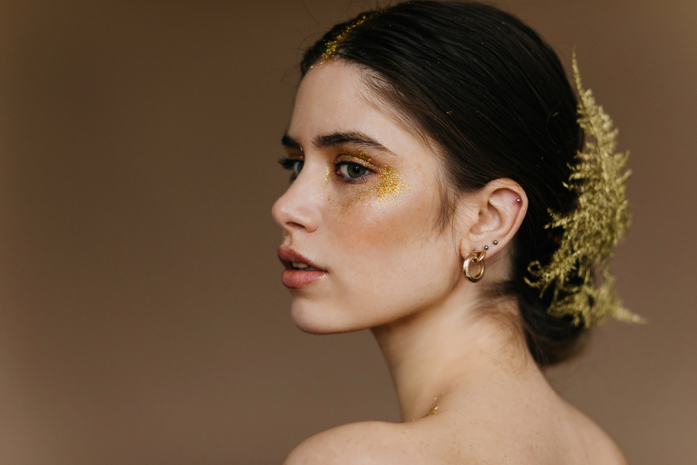 close-up-portrait-charming-woman-wears-golden-earrings-cute-brunette-girl-with-plant-hair