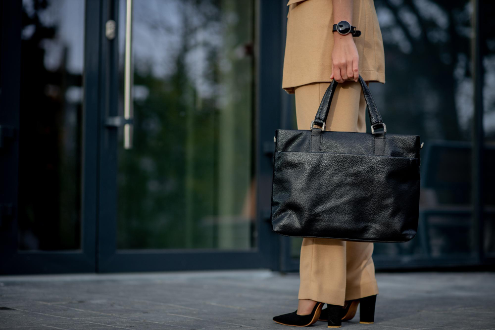 business-lady-holding-laptop-bag-going-office-display-businesswoman-modern-buildings-city (1)